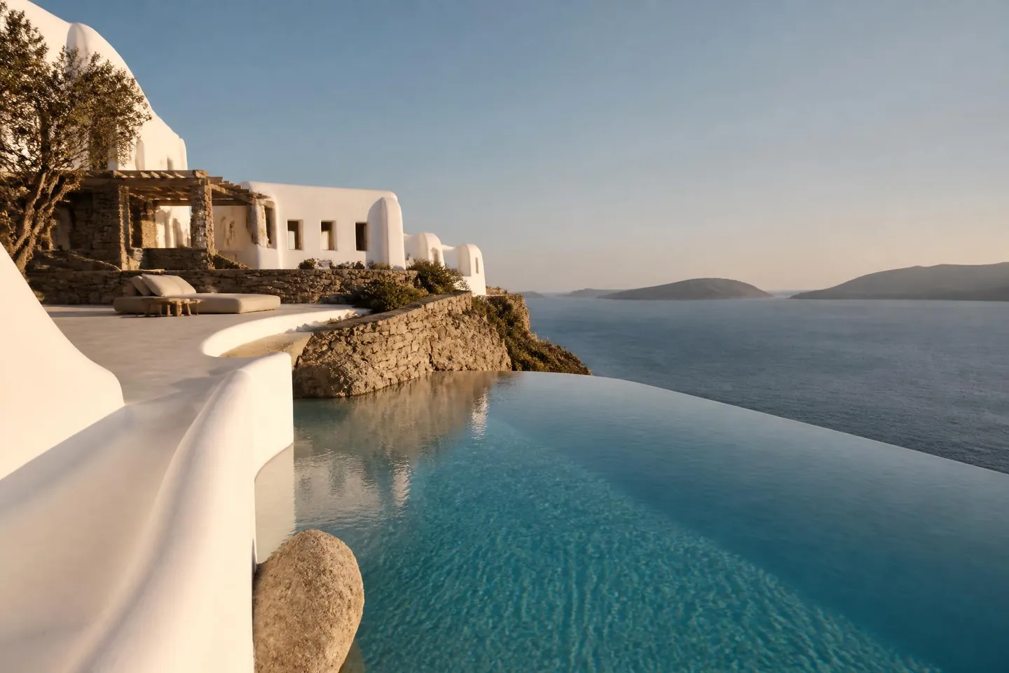 Whitewashed Cycladic villa with infinity pool overlooking the Aegean sea in Mykonos — luxury setting for mobile IV therapy